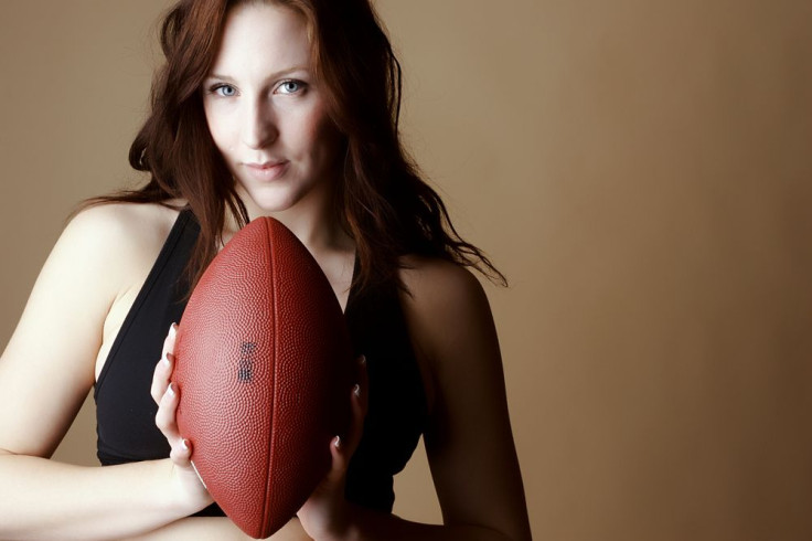 Woman holding football