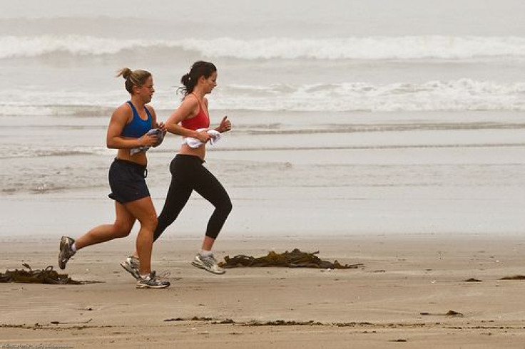 Women exercising on beach