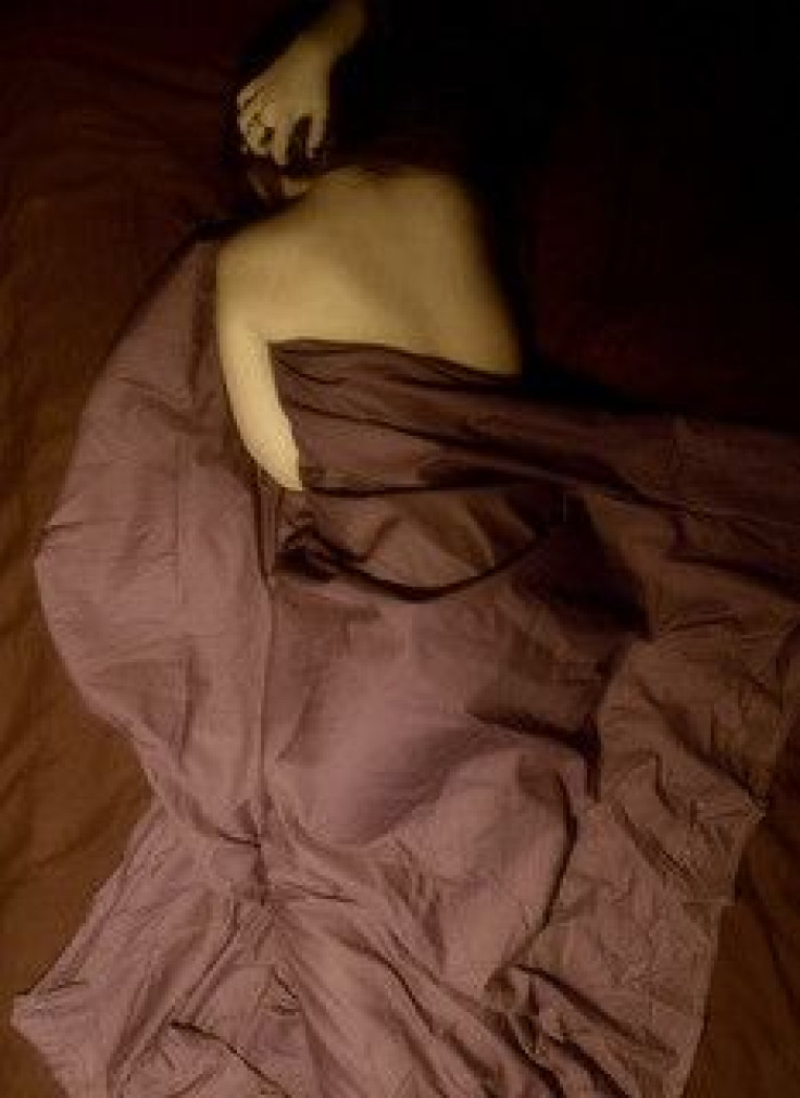 Woman in bed with pain