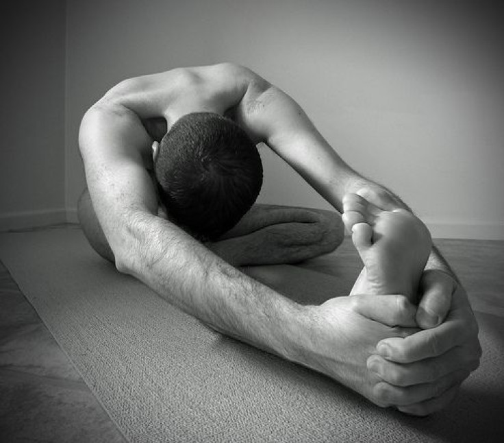 Man stretching on floor