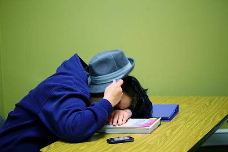 Boy sleeping in class