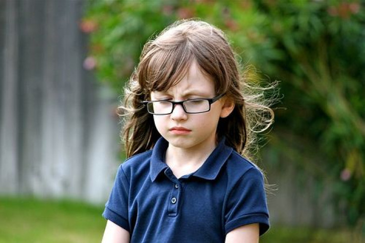 Girl with glasses pouting