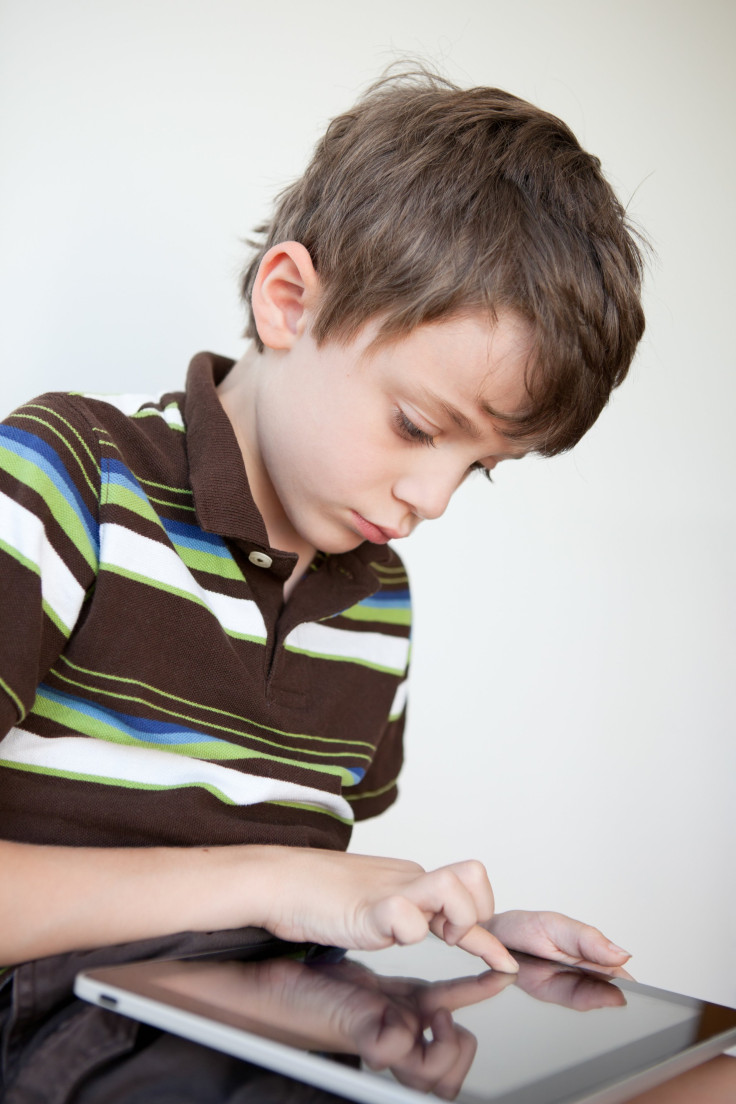 shutterstock photo of kid with iPad