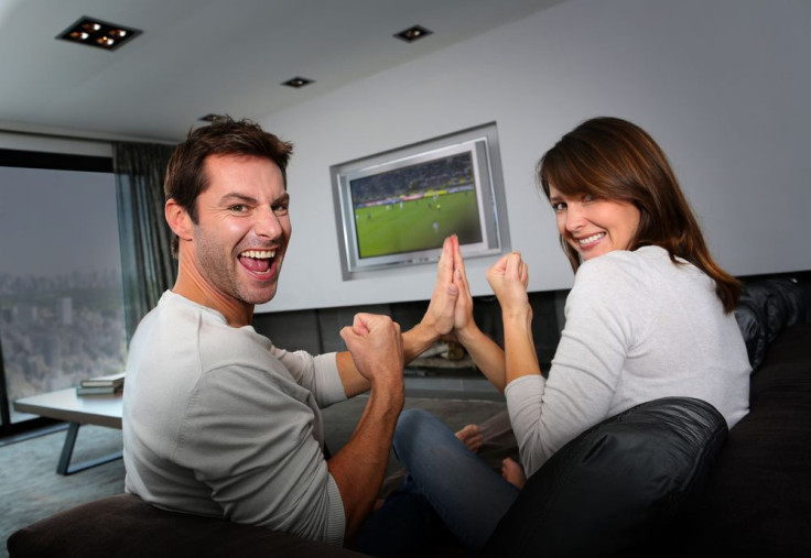 Couple watching sports together