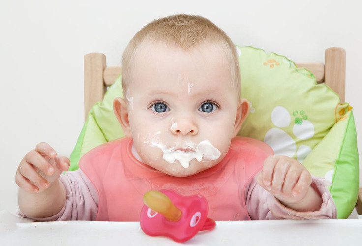 Messy baby on high chair