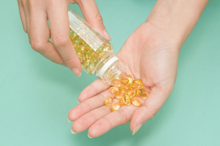 Woman taking vitamin D supplements