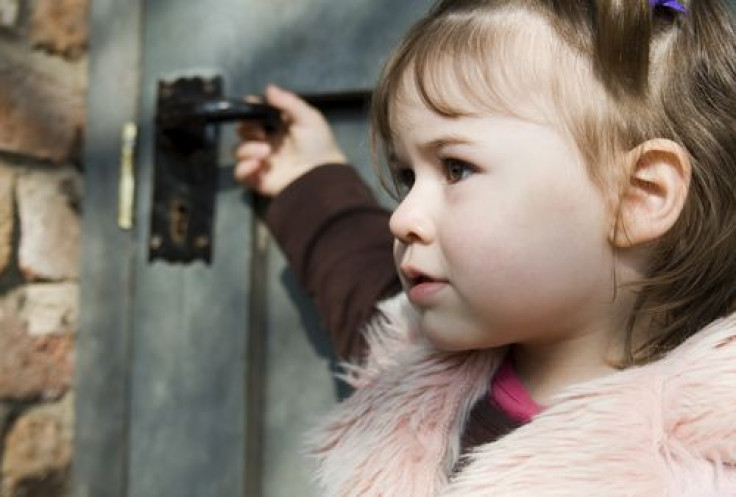 Girl opening door alone