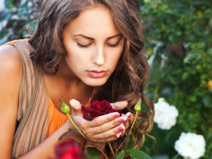 Woman smelling rose