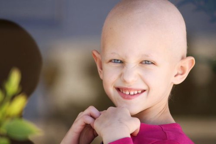 Smiling girl fighting cancer