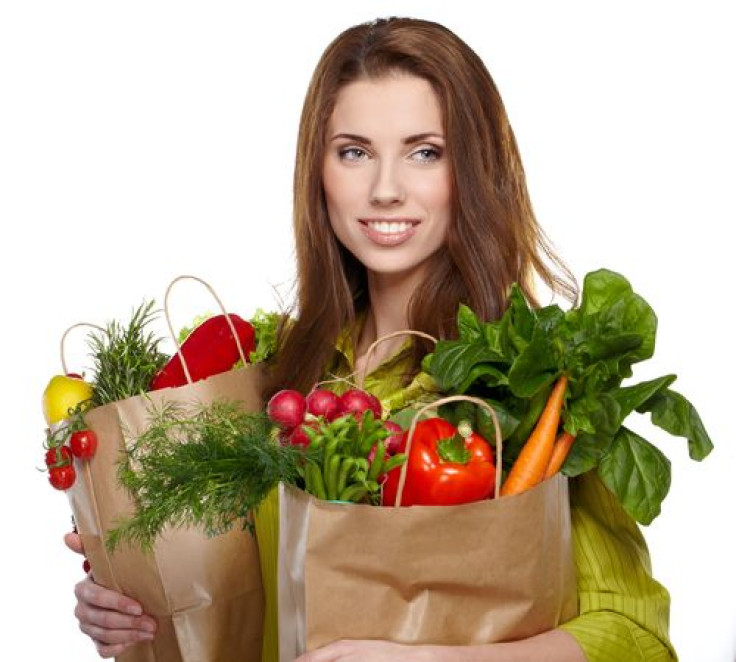 Woman holding bag of groceries