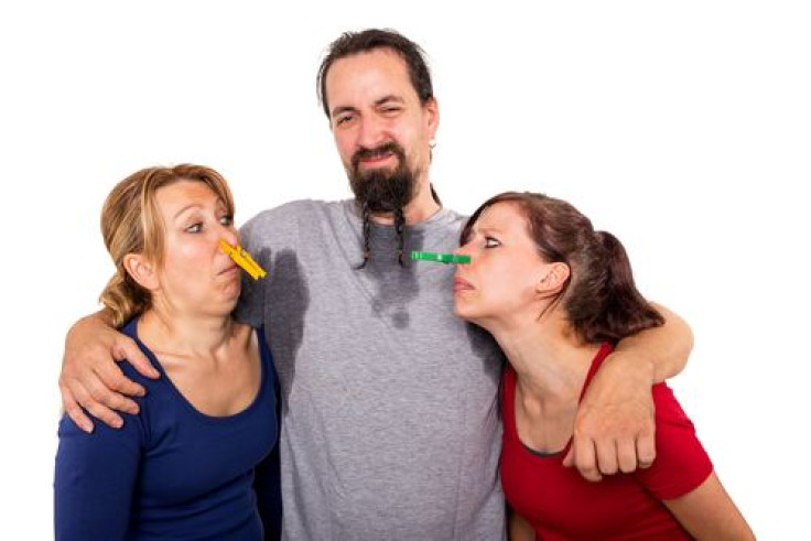 Man sweating and women do not want to smell