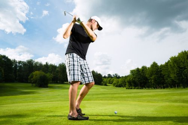 Young golfer doing golf swing