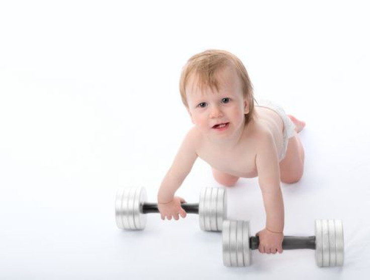 Baby lifting dumbbells