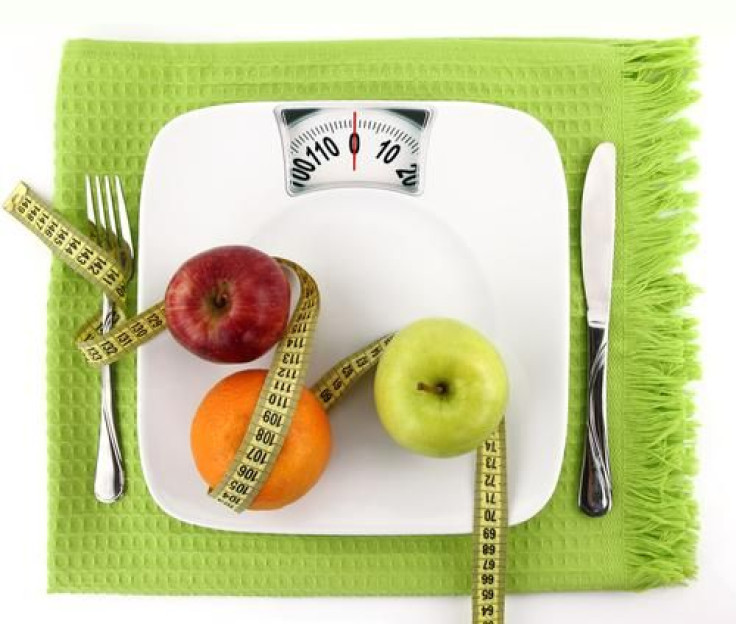 Weight scale with fruits, utensils and measuring tape