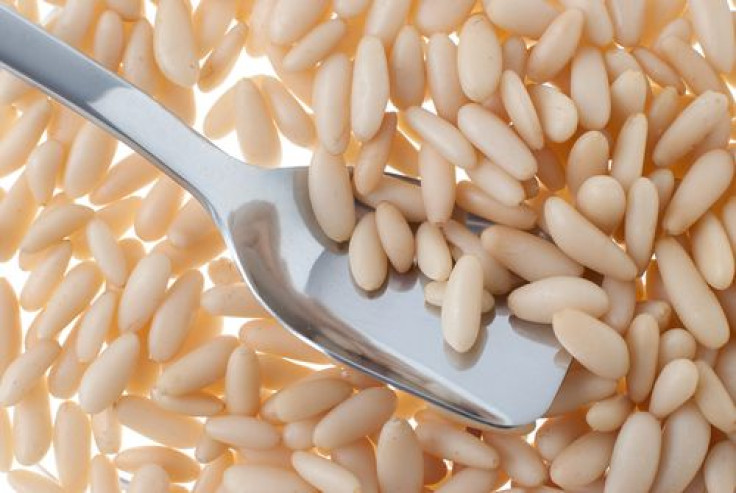 Pine nuts and spoon