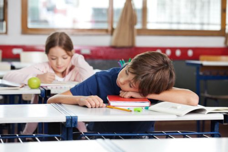 Boy asleep in classroom 