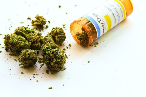Medical marijuana pouring out of prescription bottle