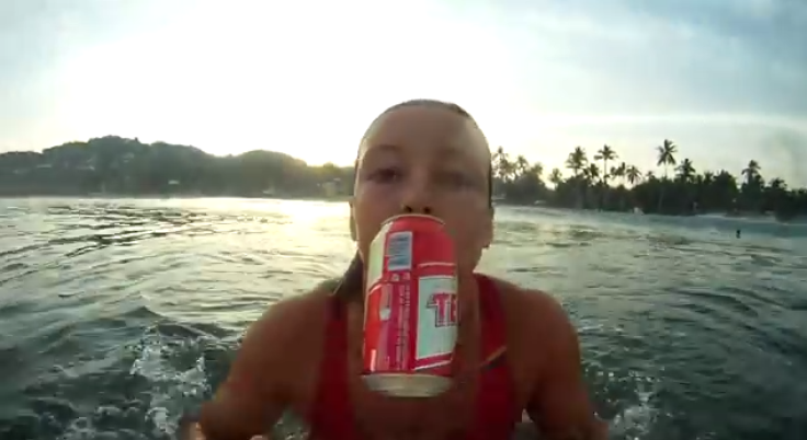 Girl surfing with drink for neknominate 