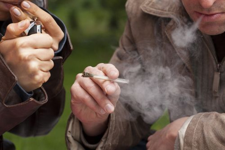 People smoking marijuana from pipe