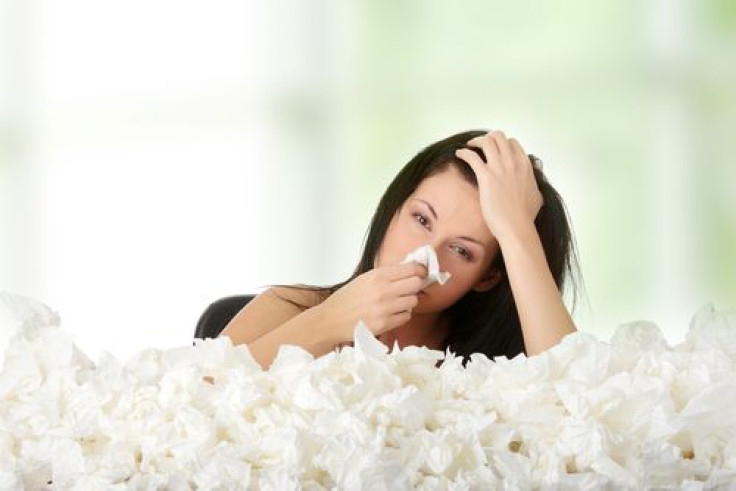 Woman surrounded by a lot of tissues