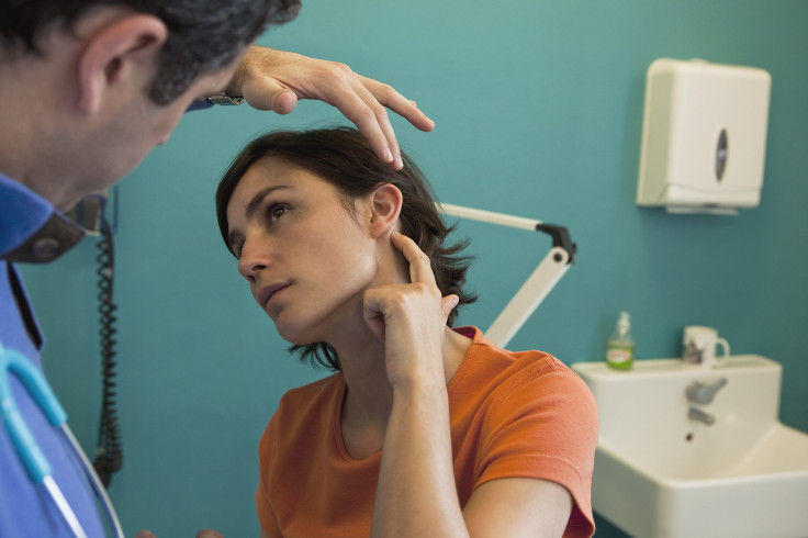 woman getting ear checked