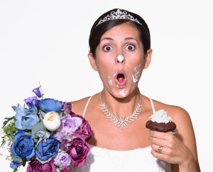 Bride with cake frosting all over her face