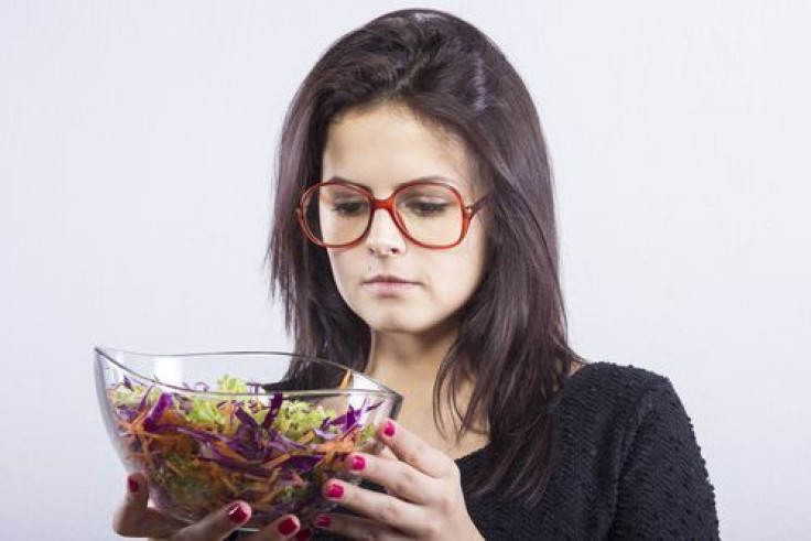 Woman in the market choosing fruits and vegetables