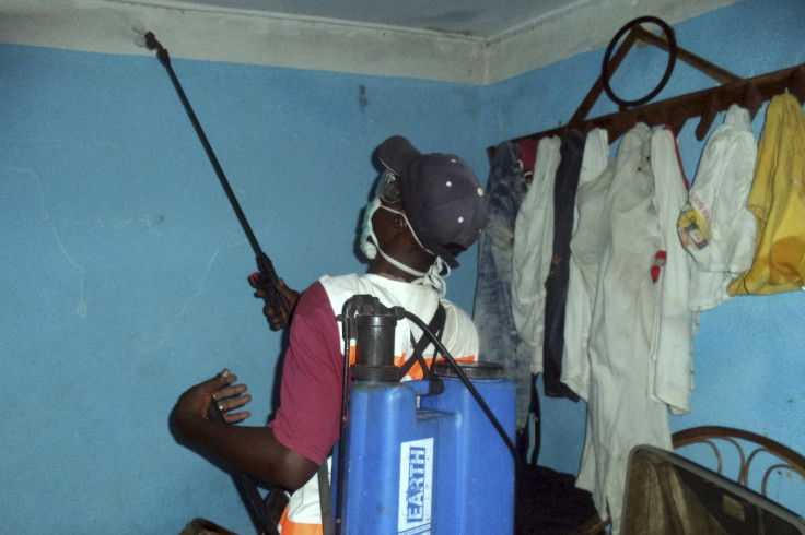 Disinfecting hospital room in Guinea