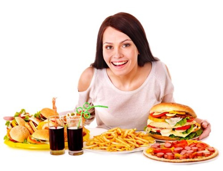 Woman eating fast food alone