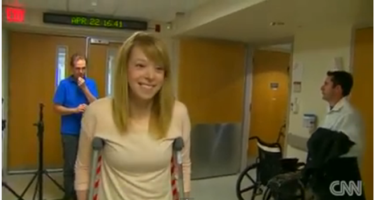 Adrianne Haslet-Davis walks with crutches in hospital