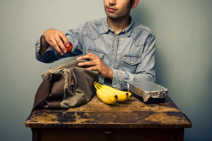 Man preparing his lunch at his desk