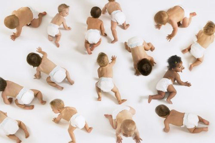 Group of multiethnic babies crawling 