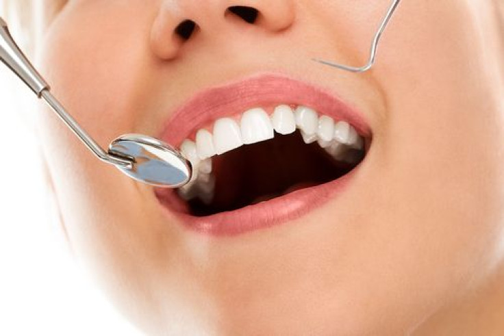 Woman smiling while at the dentist