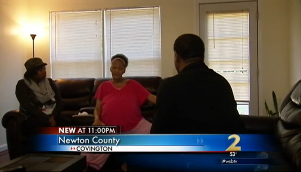 Woman with daughter and reporter