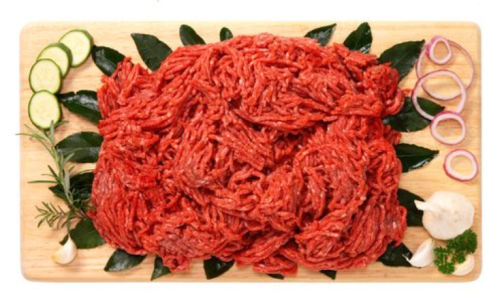 Ground beef on wooden board