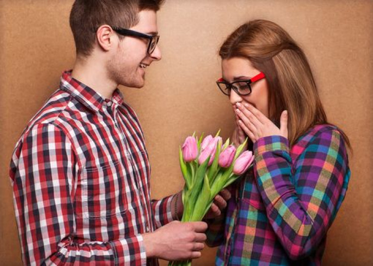 Guy giving woman bouquet