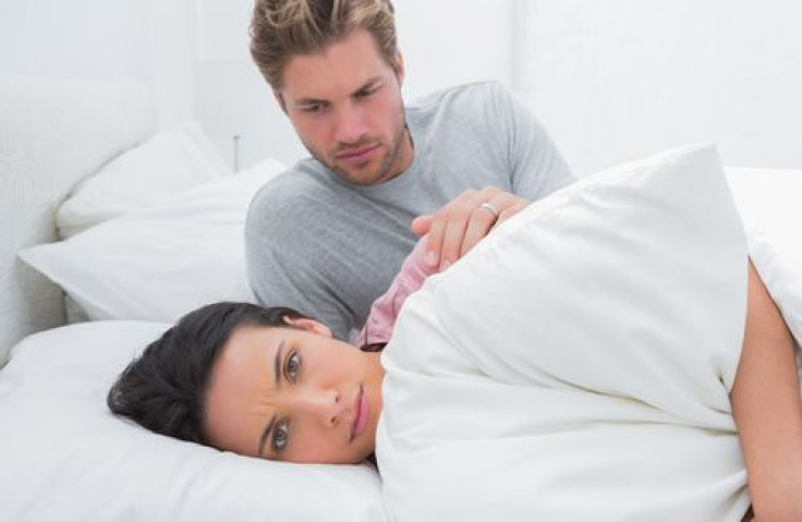 Woman ignoring husband in the bedroom during a conflict