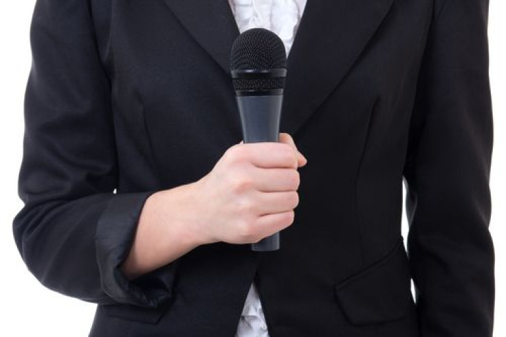 black-microphone-young-womans-hand