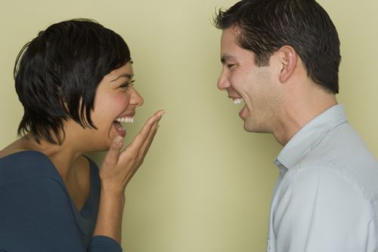 Couple laughing at each other