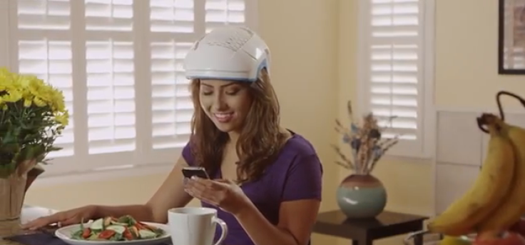 Woman wearing helmet while eating and texting