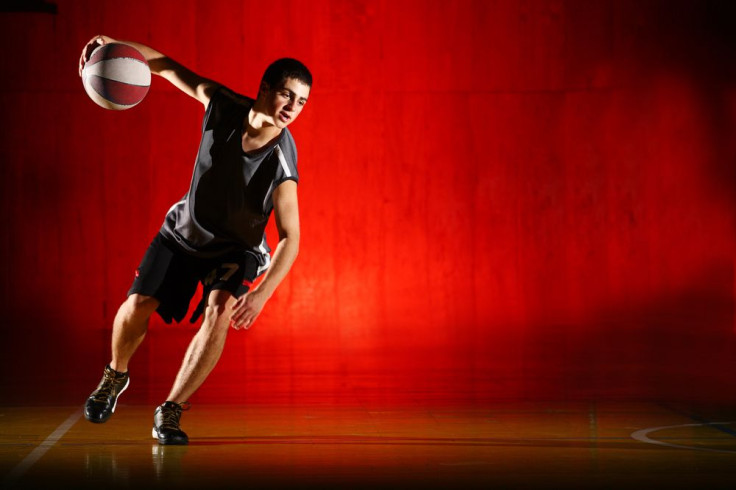 Teen Playing Basketball