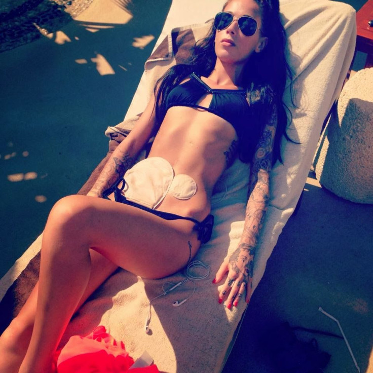 Bethany Townsend with colostomy bags in black bikini