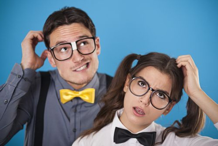 Man and woman with hands on head thinking