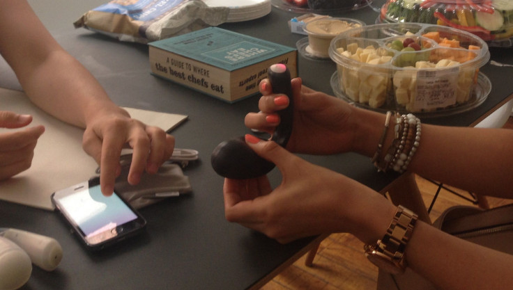 Holding the kGoal device and using the smartphone app