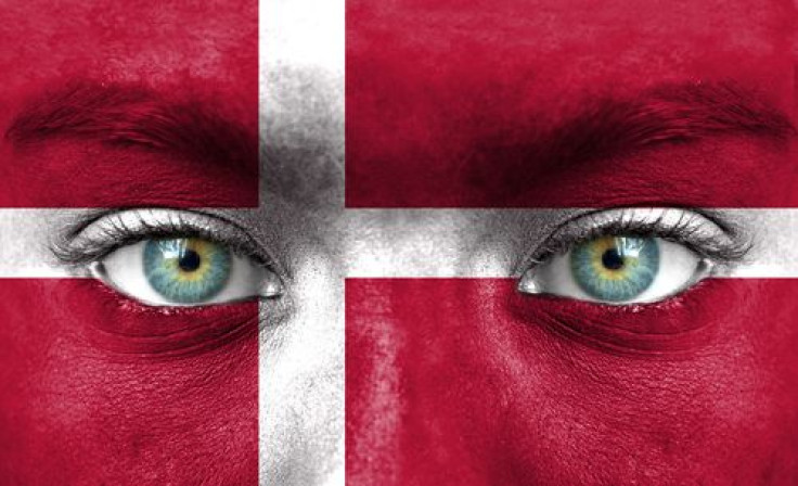 Woman's face painted with Denmark flag
