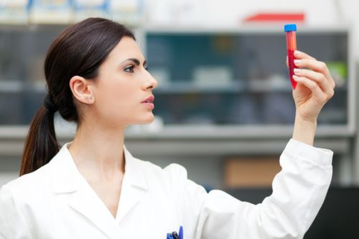 Woman researcher doing a blood test in a laboratory