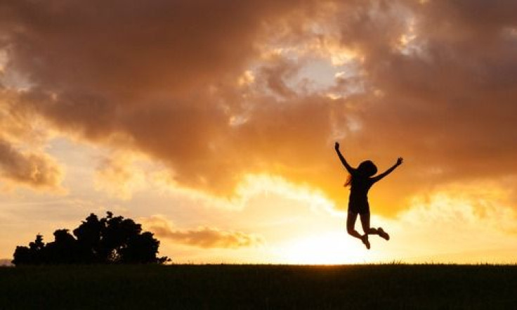 Woman jumping during sunset