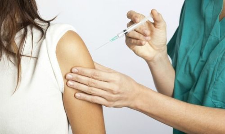 Young girl getting vaccinated