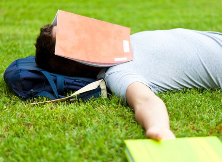 Teen sleeping with book