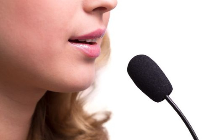 Lips of girl speaking into microphone